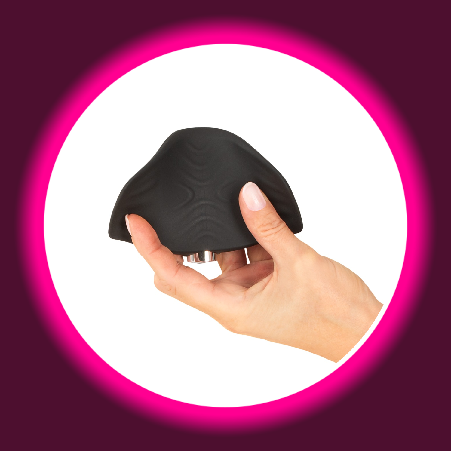 eine Hand hält einen schwarzen Vibro-Masturbator, Magic Shiver