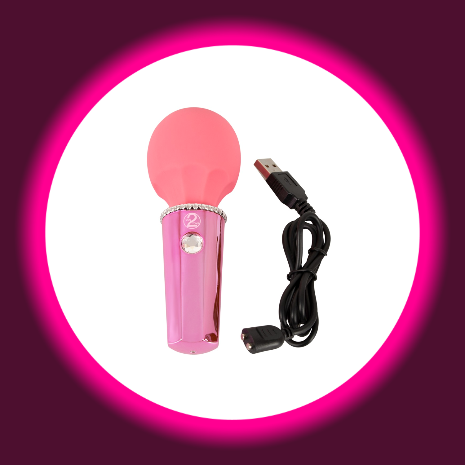 kleiner pinker Wandvibrator von You2Toys mit Glitzerstein als Startknopf, daneben ein USB-Ladekabel
