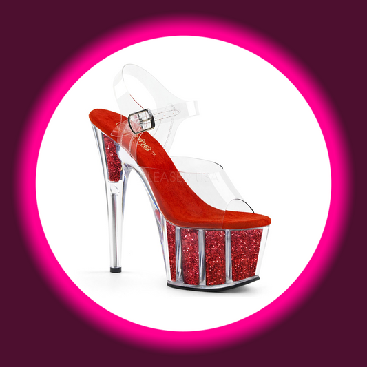 Winkelansicht auf eine rote glitzernde Plateau Sandalette mit transparenten Elementen