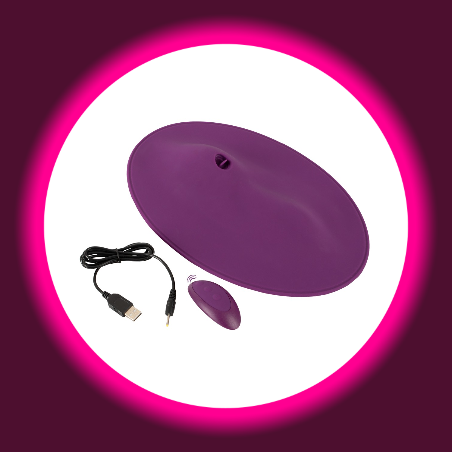violettes Vibepad 2 Vibrokissen mit Leckzunge und Vibrohügeln, daneben Fernbedienung und USB-Ladekabel