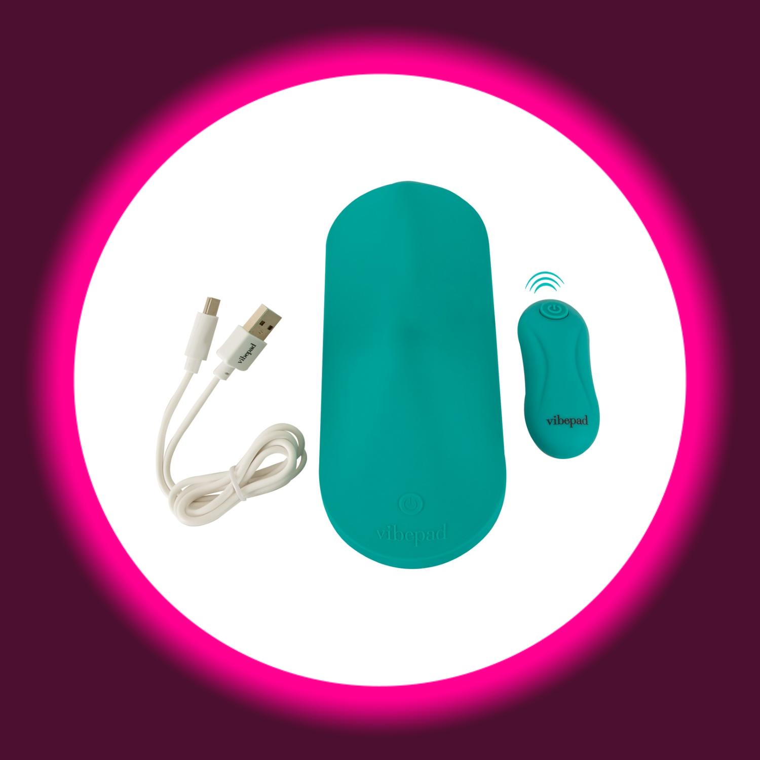 türkisfarbenes Vibrokissen Vibepad Intense, daneben USB-Ladekabel und Fernbedienung