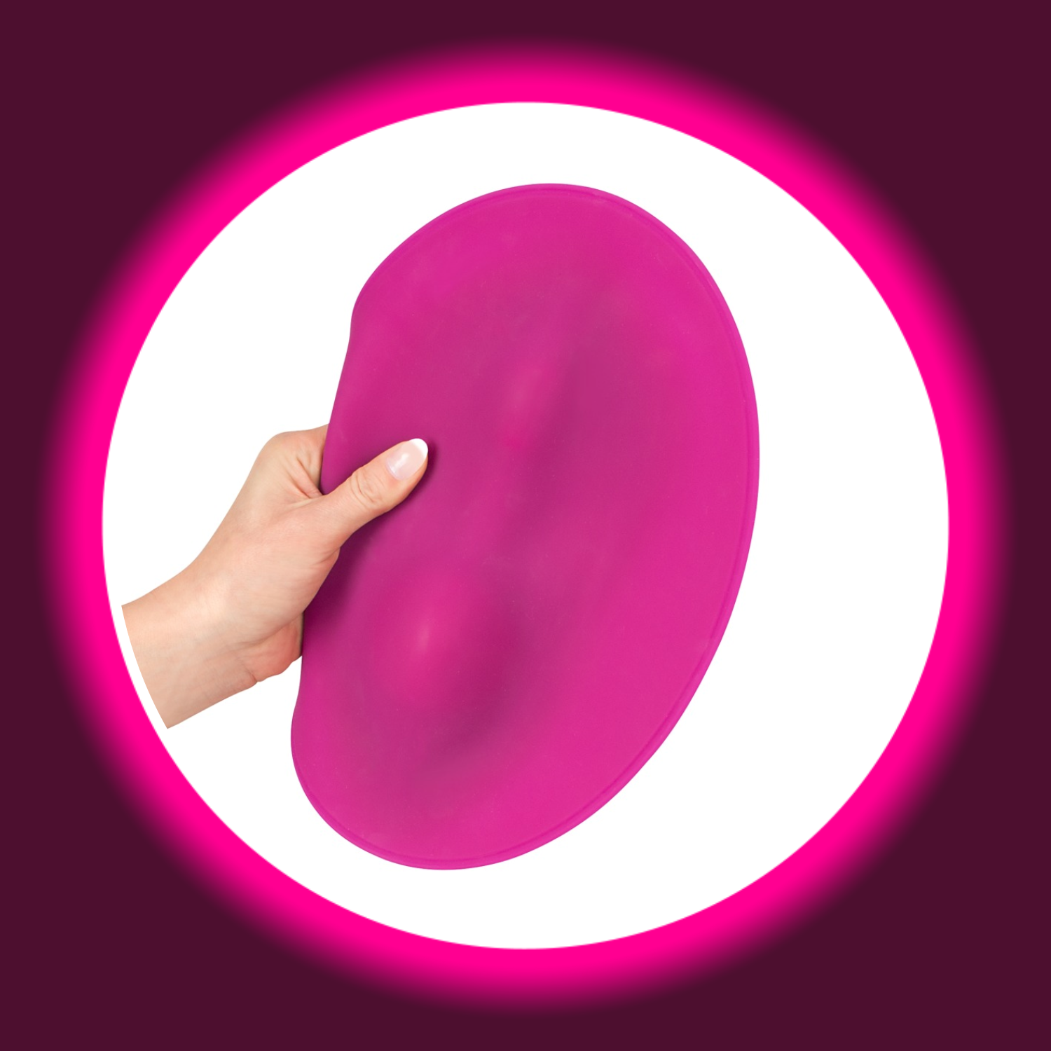 pinkes Vibrokissen Vibepad, von einer Hand gehalten