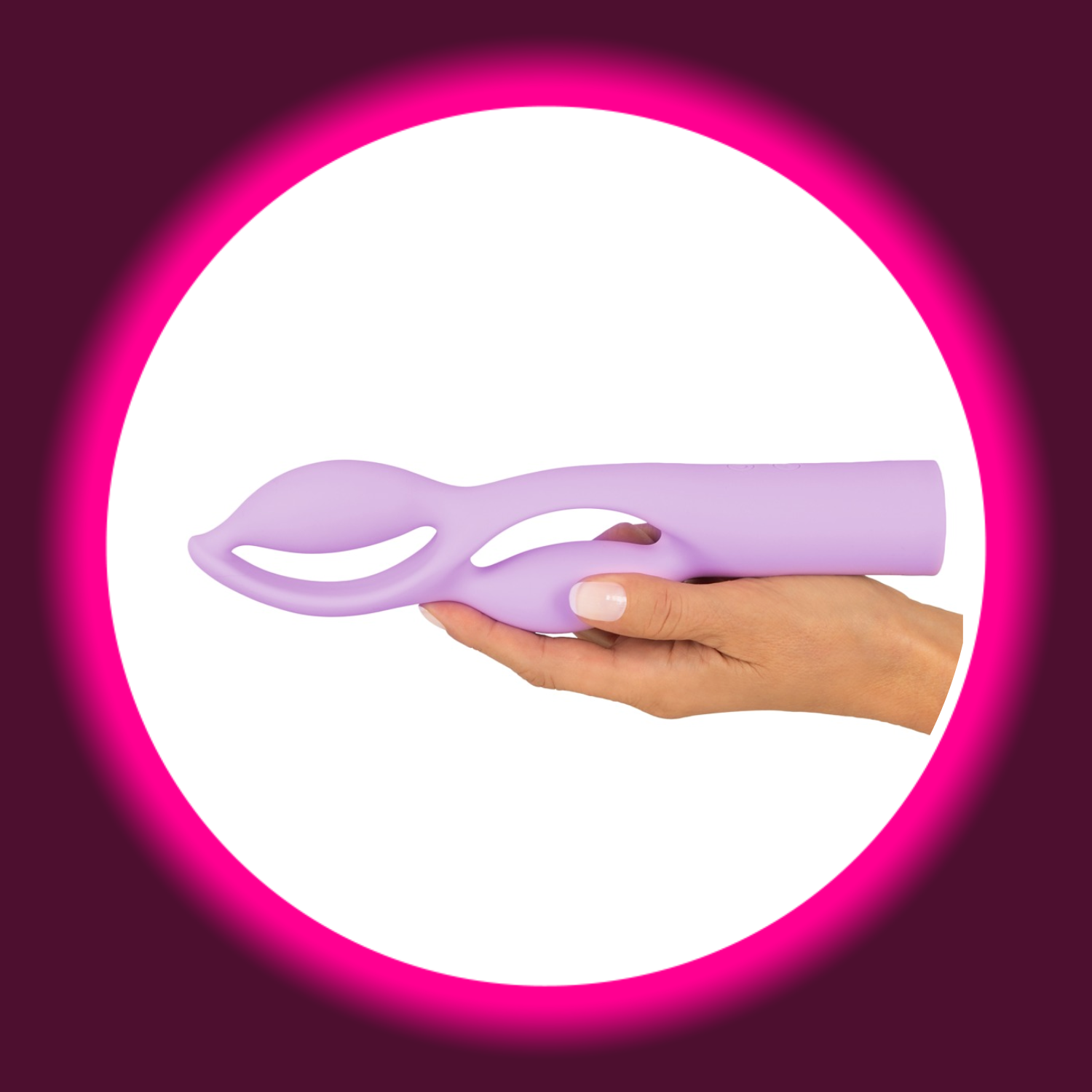 eine Hand hält einen violetten Designer-Vibrator Fabulous mit zwei geschwungenen Windungen von You2Toys